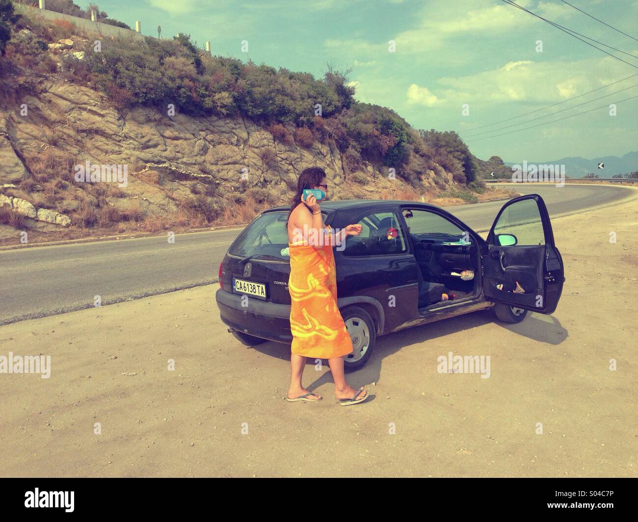 Woman with towel part from beach - Smartphone Captured Stock Image