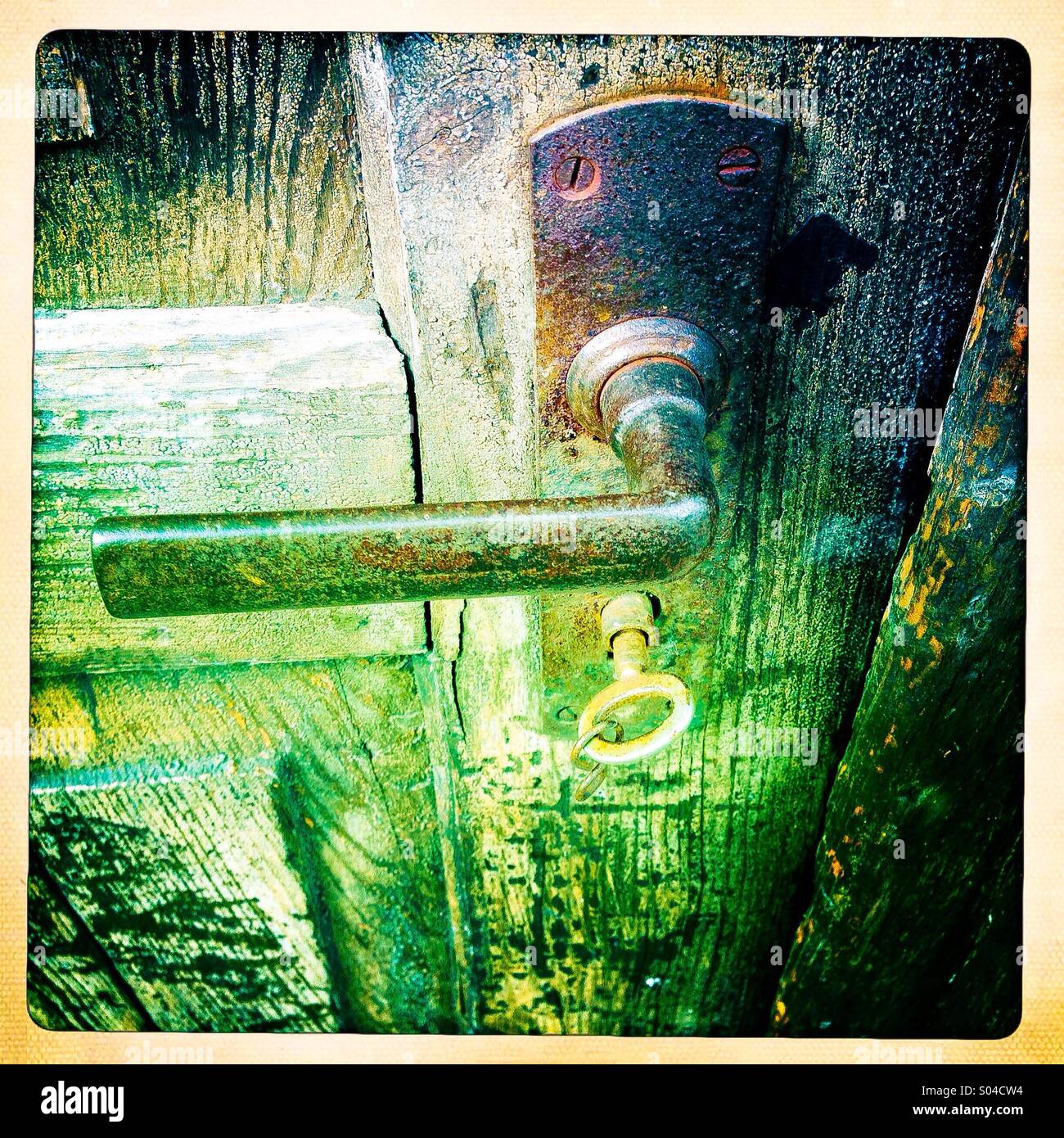 shed door handle with key in lock - Smartphone Captured Stock Image
