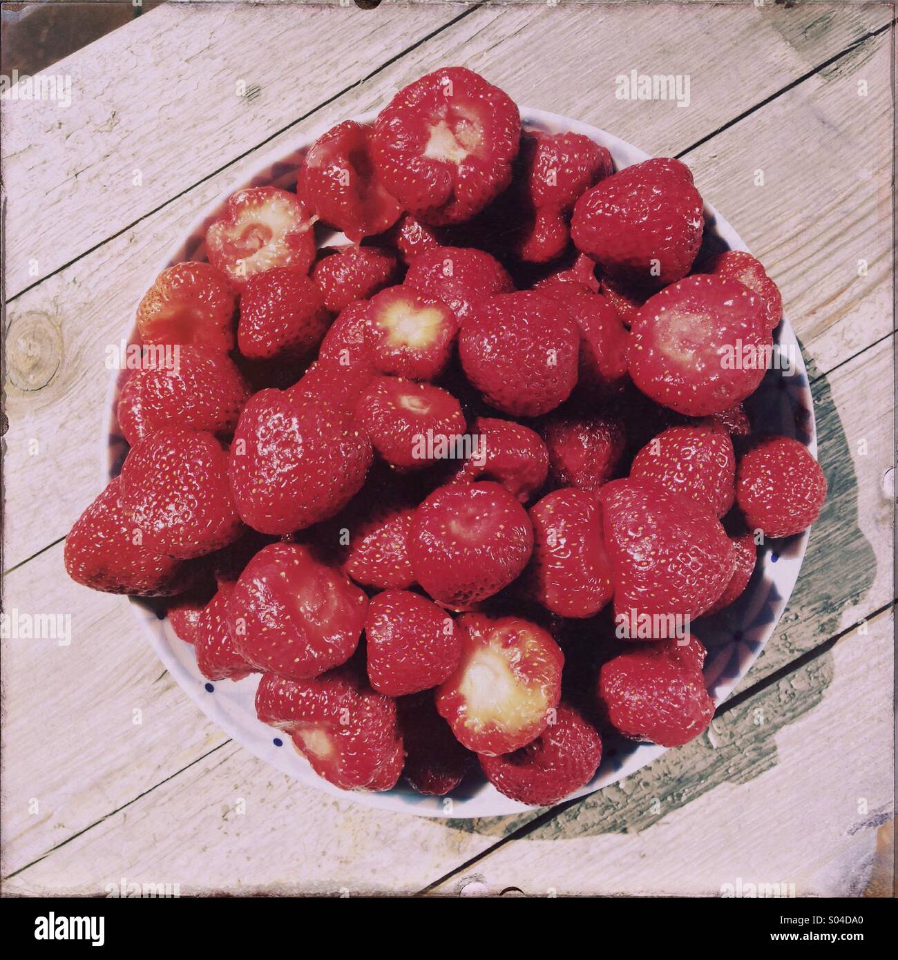 A bowl of strawberries is seen. Stock Photo