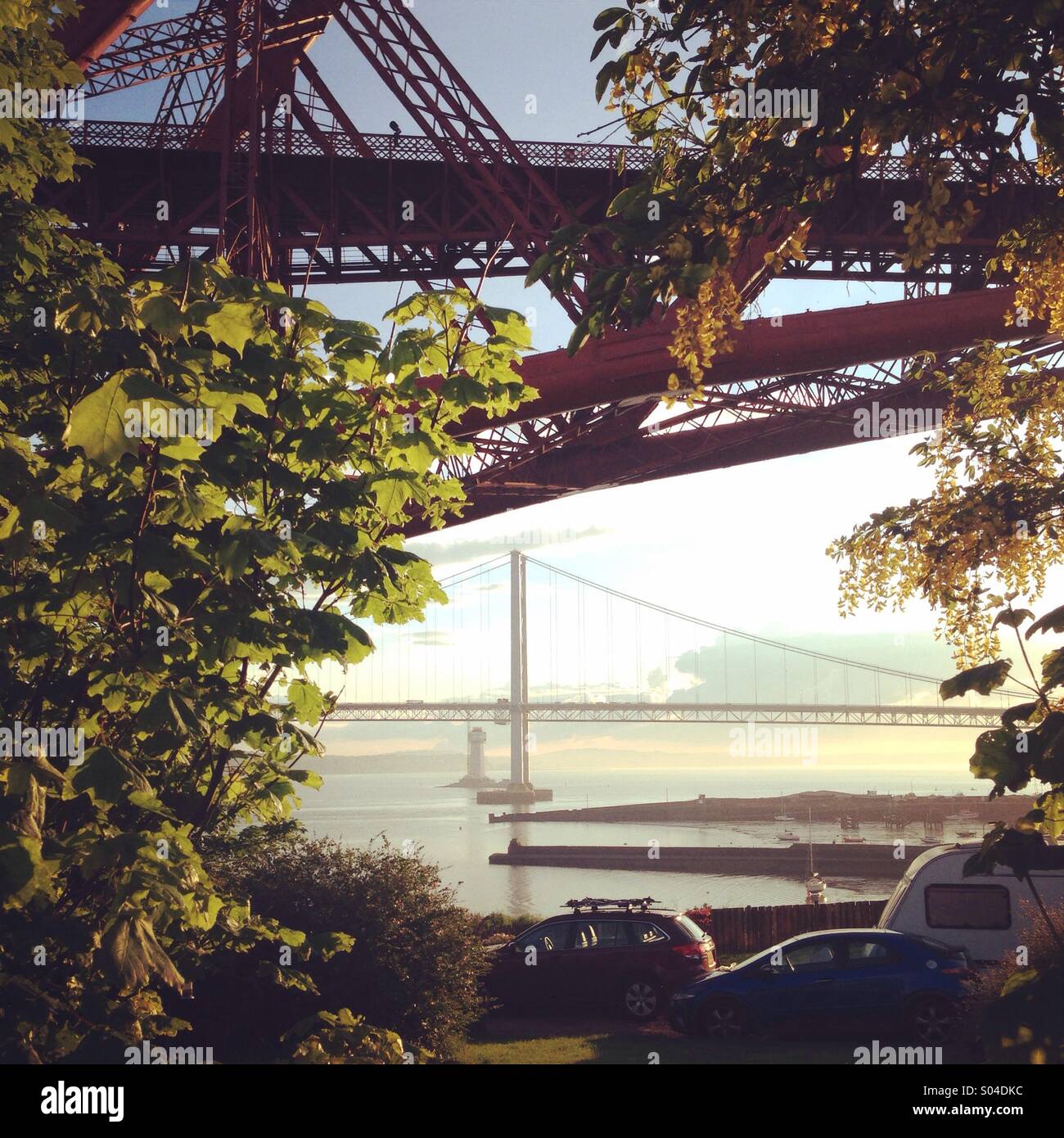 The Three Bridges. The Forth Bridge, the Forth Road Bridge and the beginnings of the Queensferry Crossing, as seen from Fife. - Smartphone Captured Stock Image
