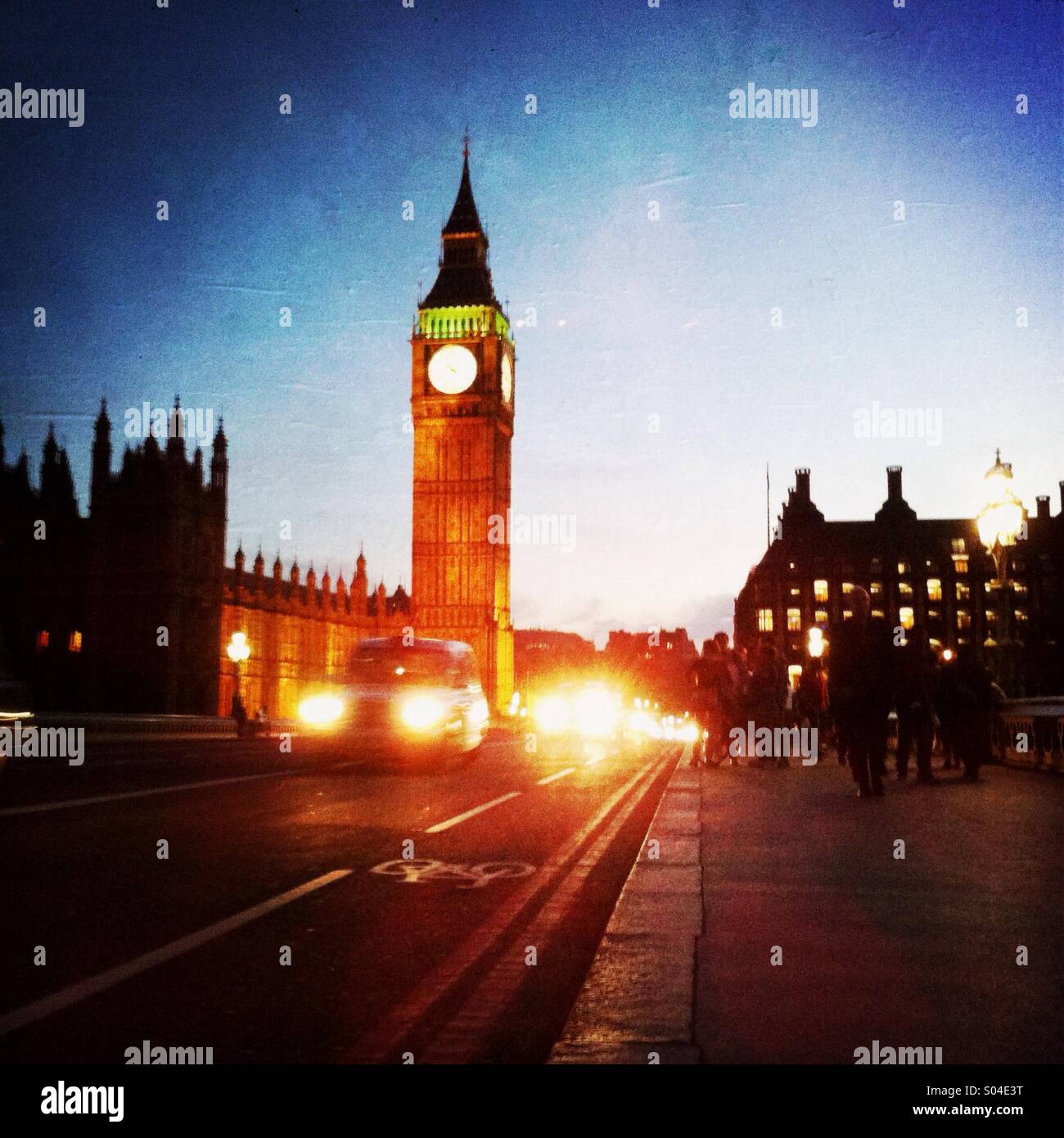 A cab dives on the Westminster bridge with Big Ben in the back ground. London England. UK - Smartphone Captured Stock Image