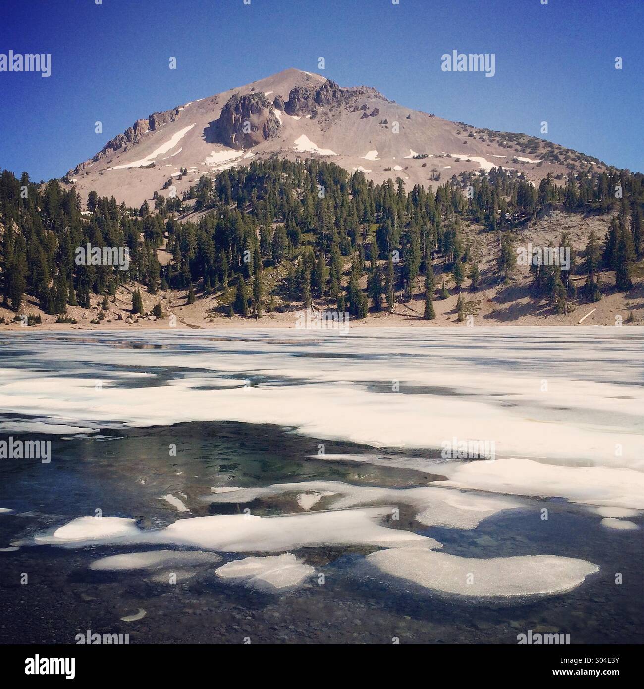 Melting ice on Lake Helen with Mt. Lassen behind, Lassen Volcanic National Park, California - Smartphone Captured Stock Image