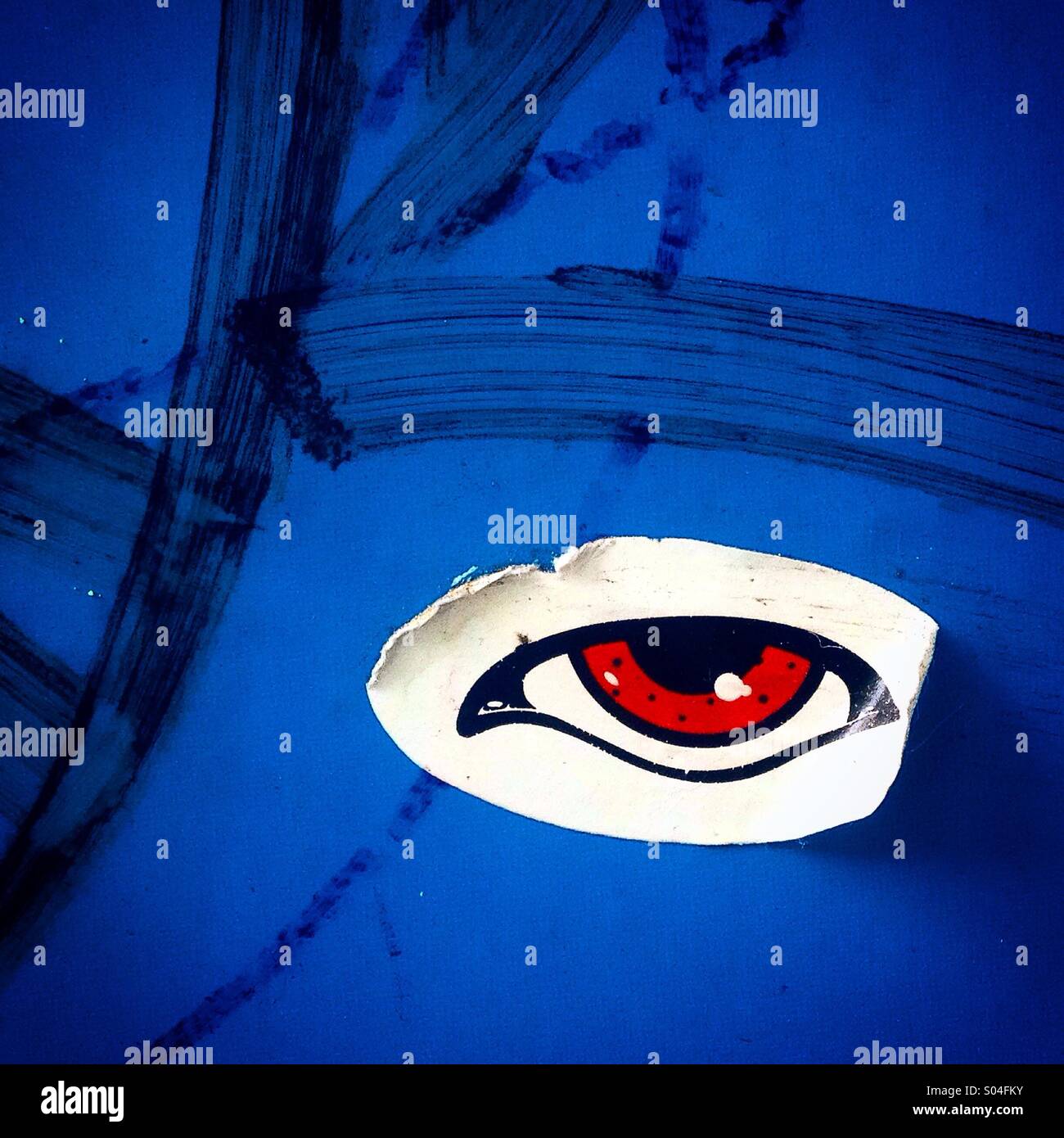 Eye sticker in a blue wall in Colonia Roma, Mexico City, Mexico Stock Photo