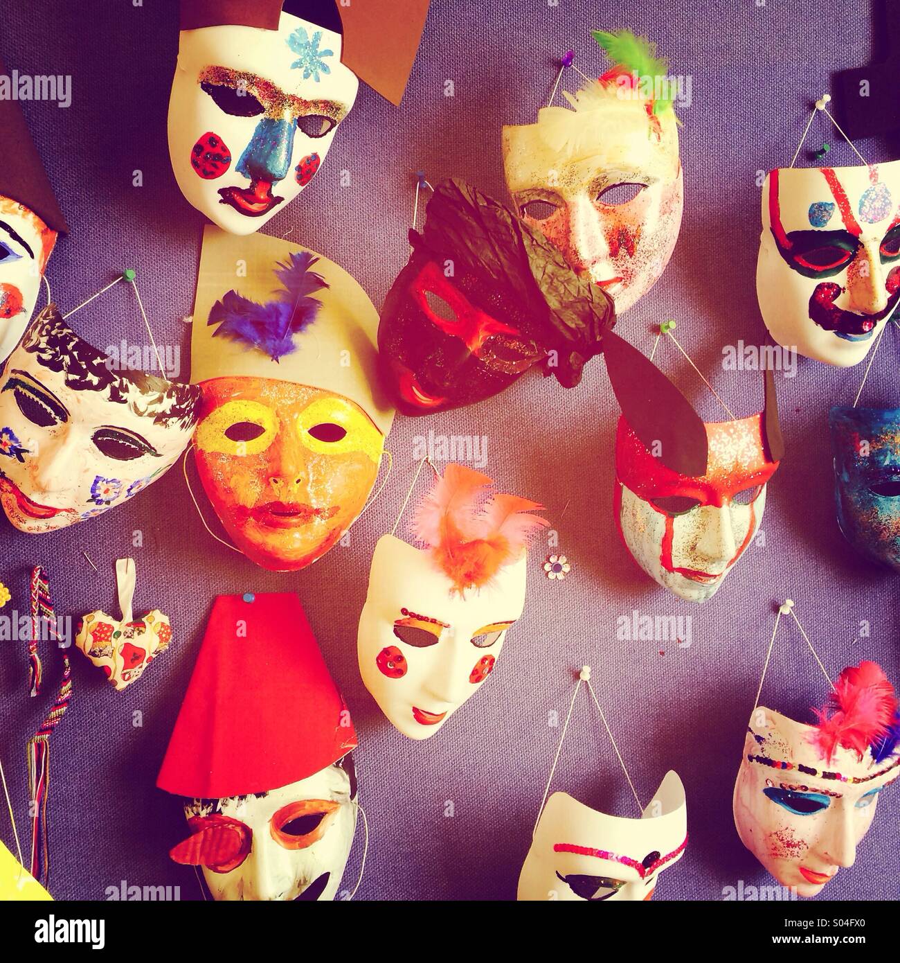 Masks hanging on a wall Stock Photo Alamy