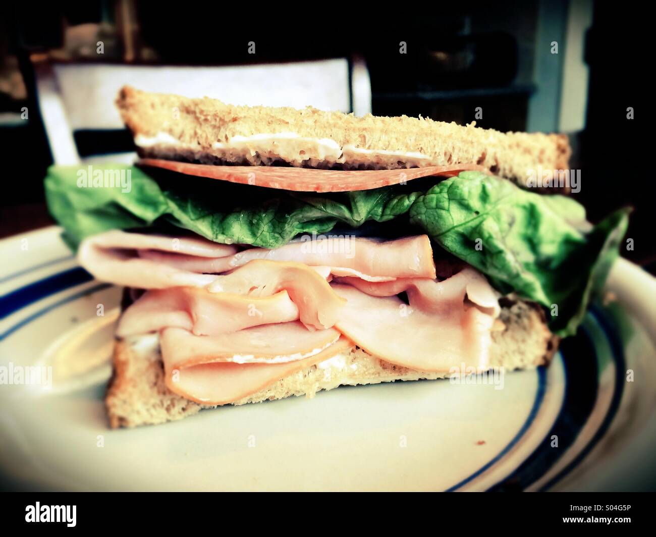 Ham and salami sandwich on a plate Stock Photo Alamy