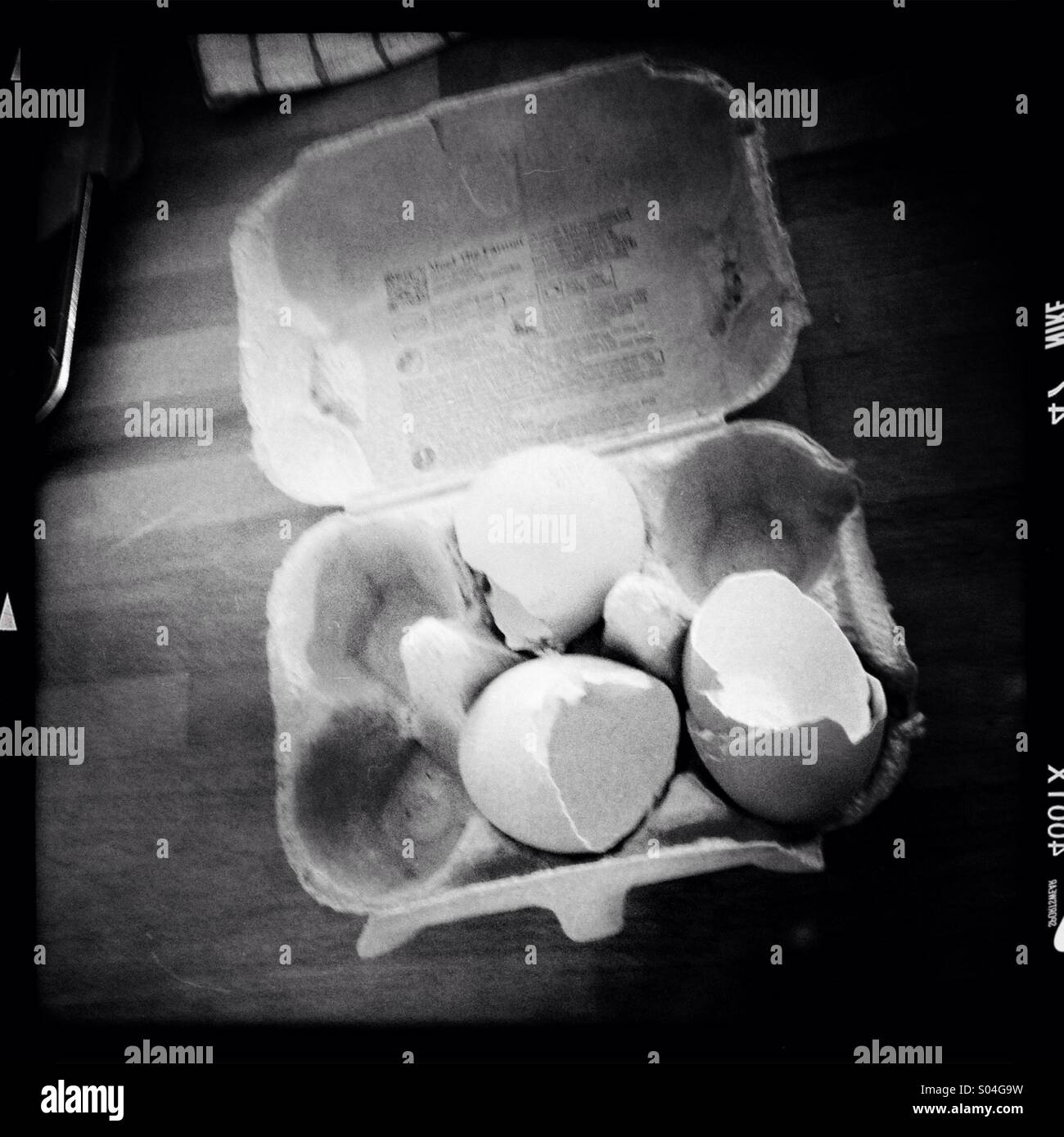 Broken egg shells in an egg box or carton - Smartphone Captured Stock Image