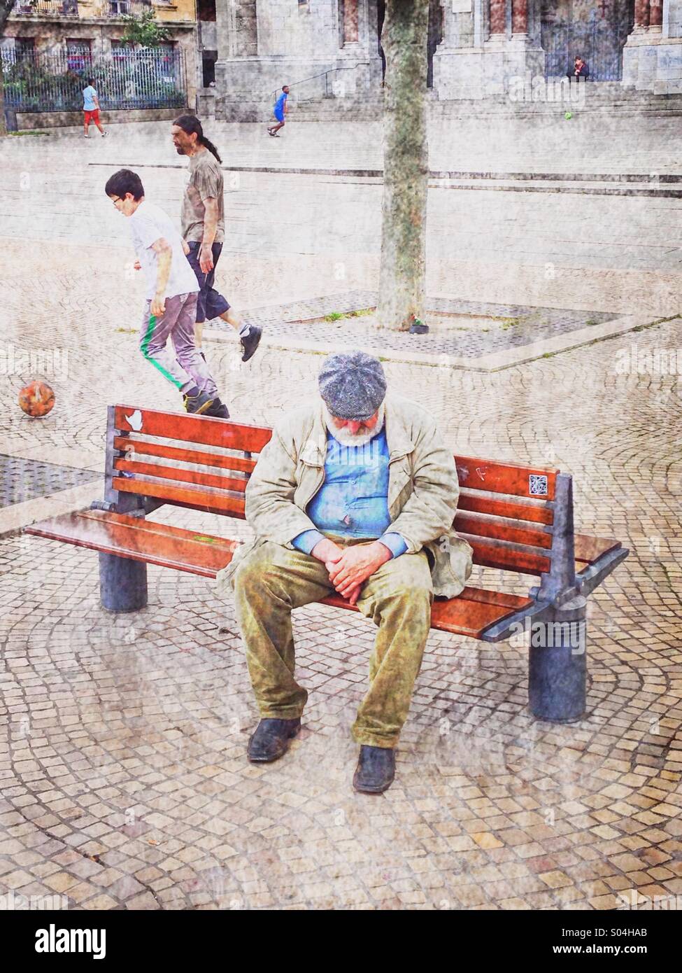 Old person sleeping on a bench,Saint-Etienne,France - Smartphone Captured Stock Image