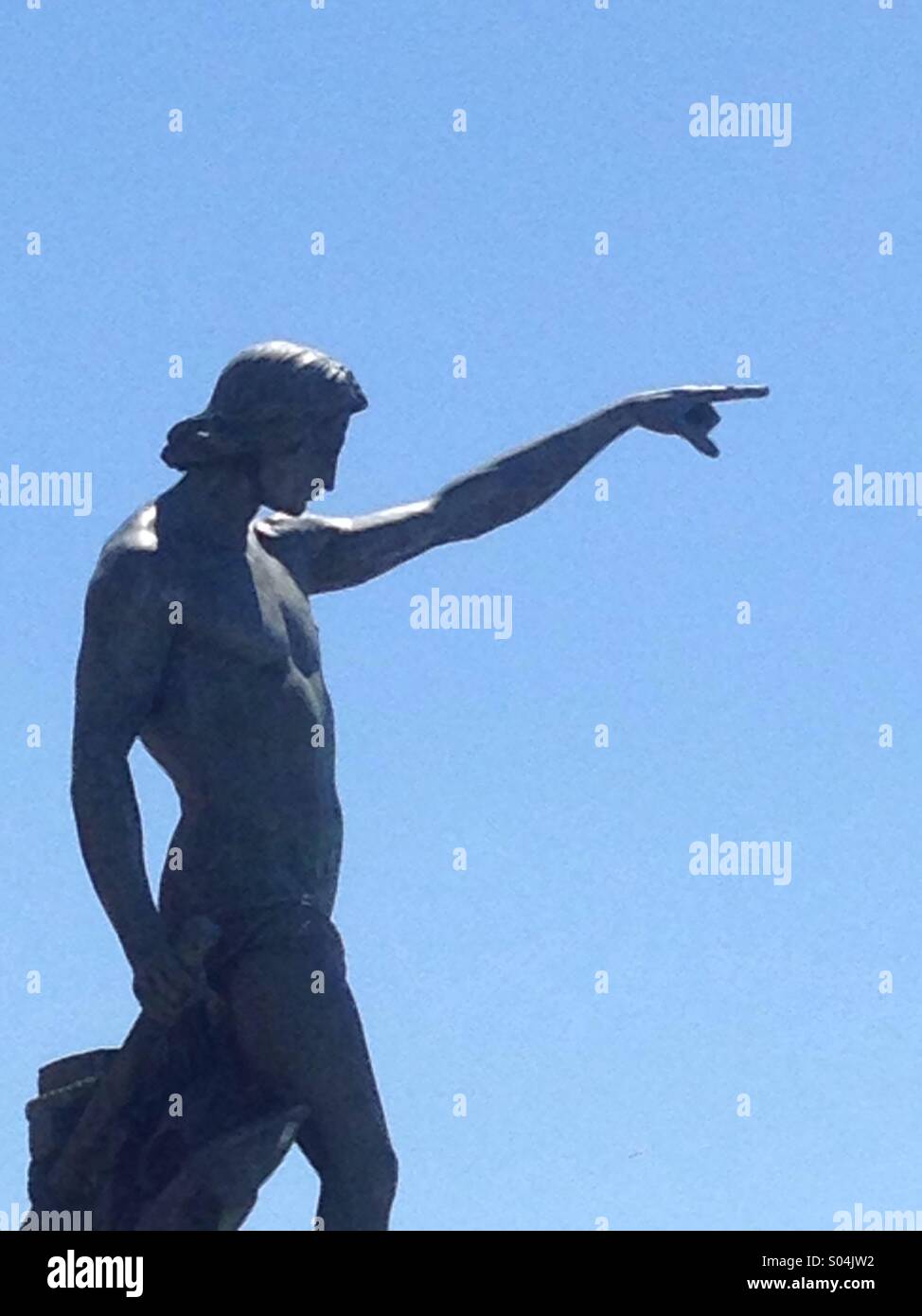 Greek God Statue standing on Toulon Harbour Provence pointing to the sea against a blue Sky - Smartphone Captured Stock Image