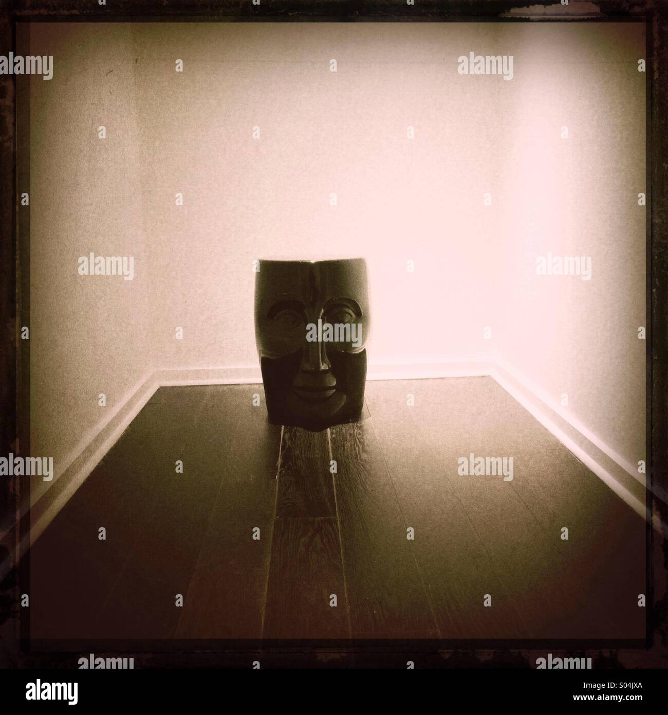 African like sculpture in wood decorating Upper East side wealthy apartment - Smartphone Captured Stock Image