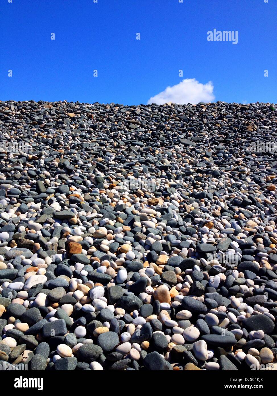 Beach Stones and cloud Stock Photo