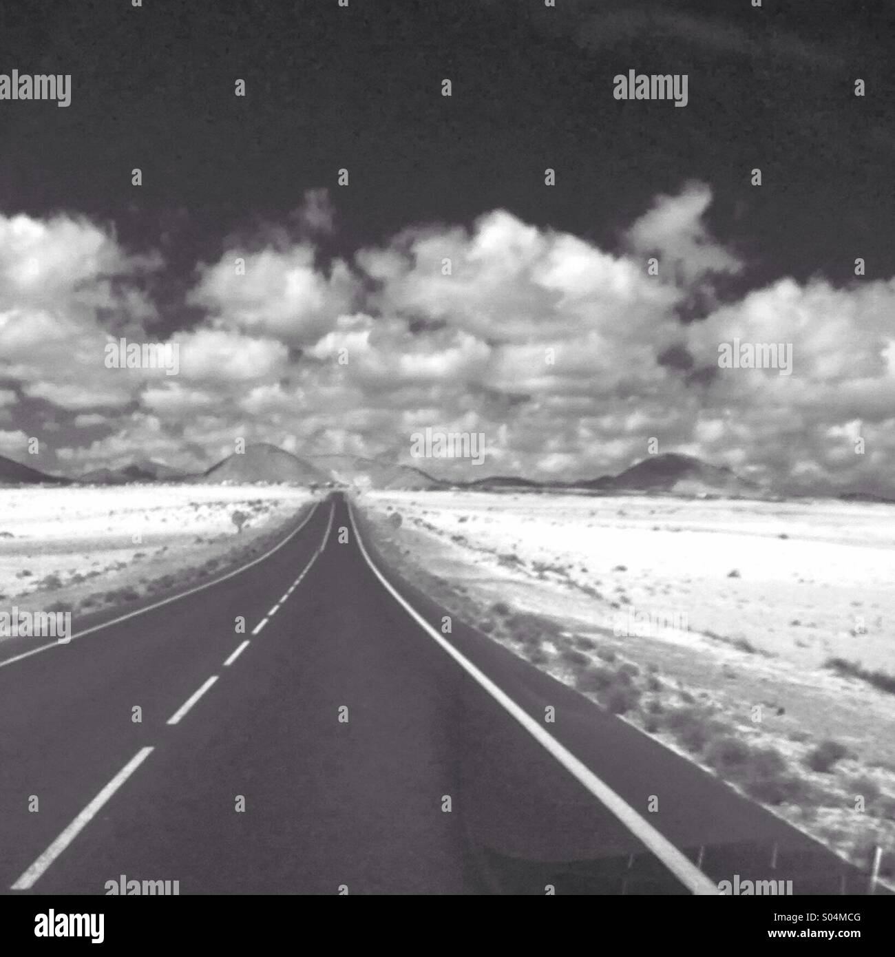 Road leading to mountains on Lanzarote Stock Photo