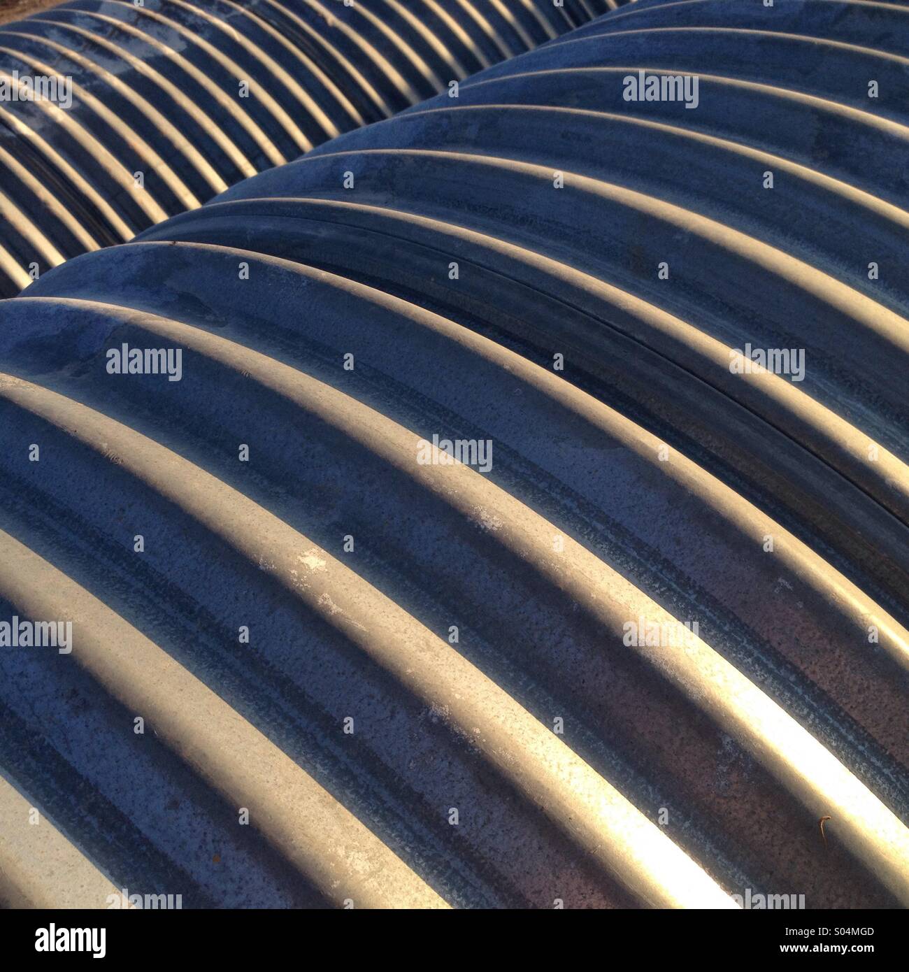 Metal pipes in a row. - Smartphone Captured Stock Image
