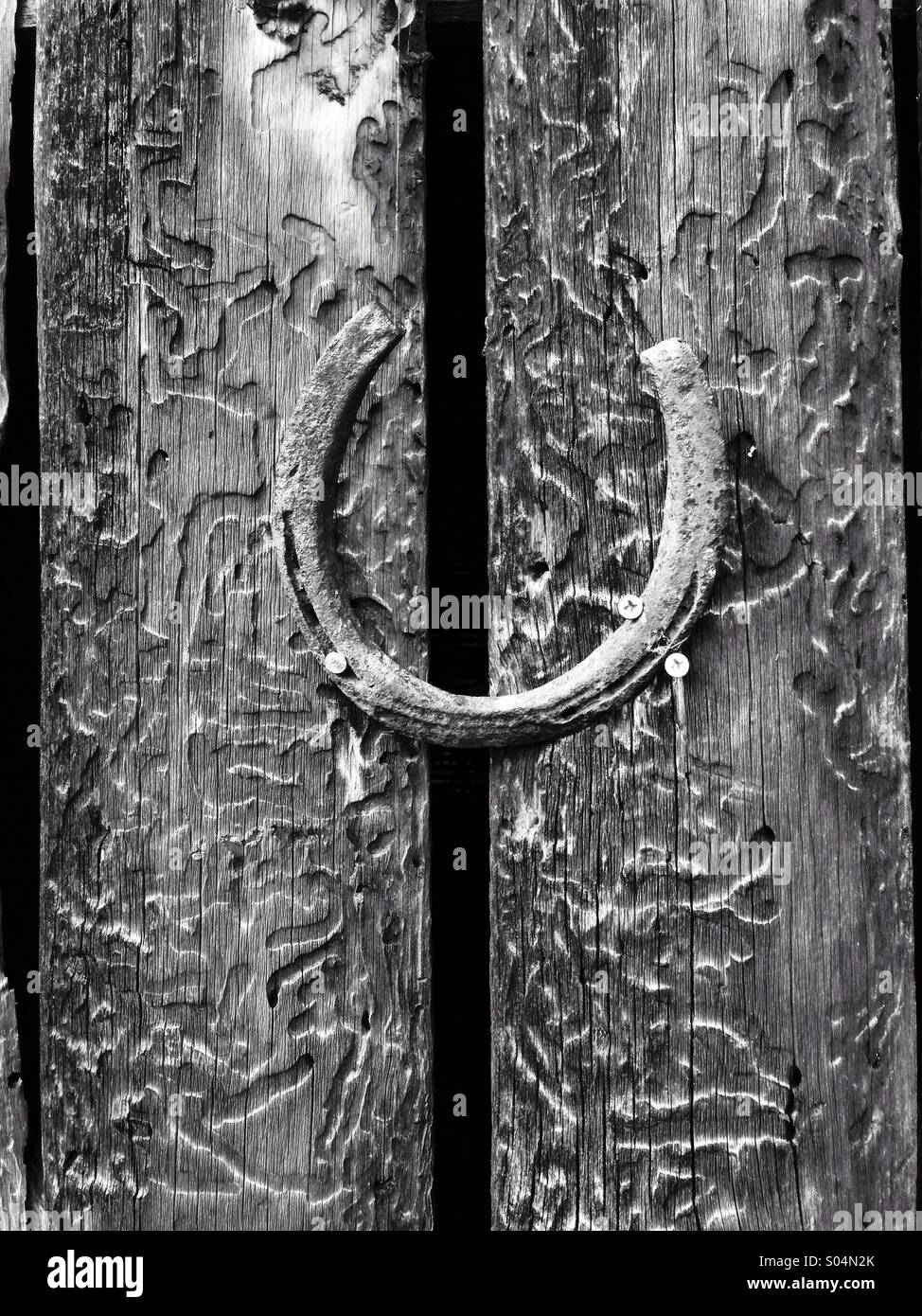 Horseshoe on old wooden boards - Smartphone Captured Stock Image