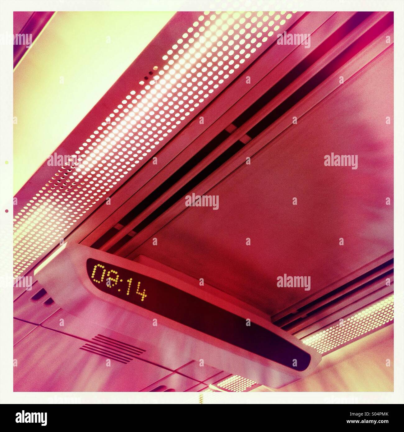 Train interior and digital clock readout Stock Photo Alamy