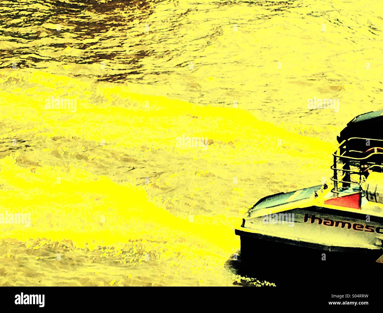 Thames clipper riverboat speeding along with trails left in water - Smartphone Captured Stock Image