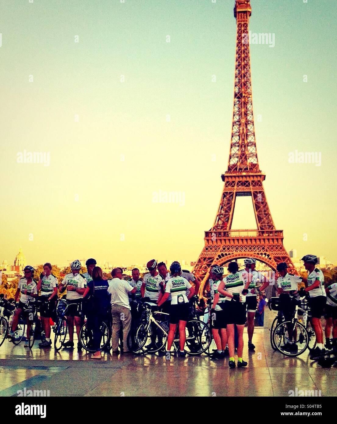 Bicyclers contemplating the Eiffel tower, France Stock Photo