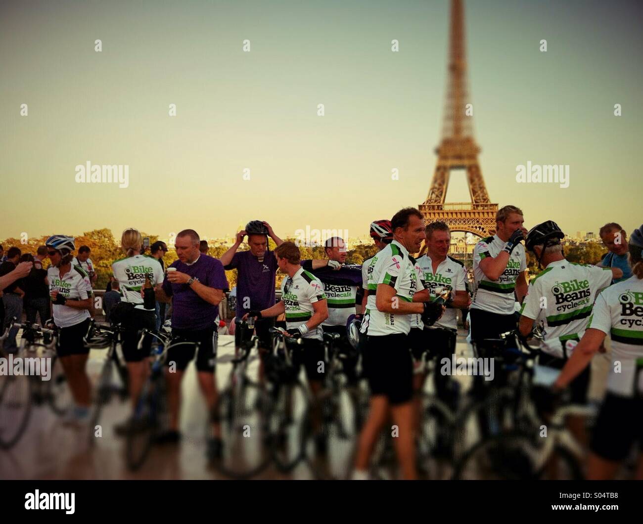 Happy bicyclers in front of Eiffel tower, Paris,France Stock Photo