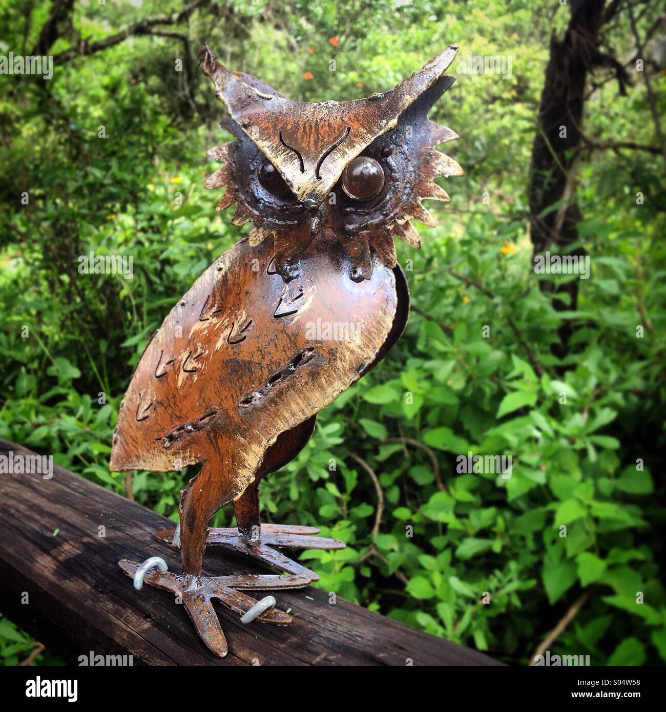 A metallic sculpture of an owl decorates a trail for tourists in Peña de Bernal, Queretaro state, Mexico - Smartphone Captured Stock Image