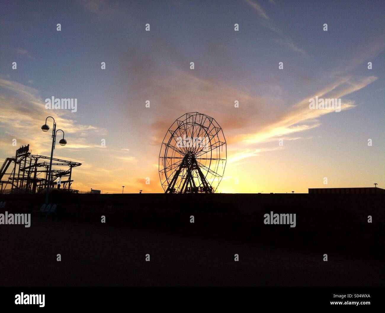 Sunset over Skegness Ferris wheel Stock Photo