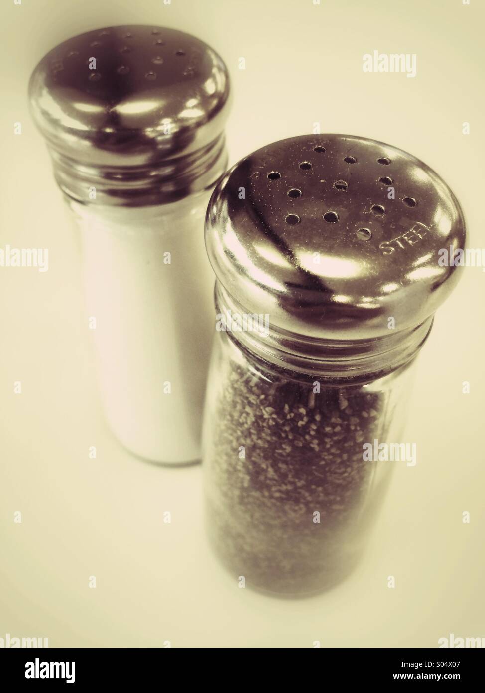 Salt and pepper shakers with chrome caps Stock Photo