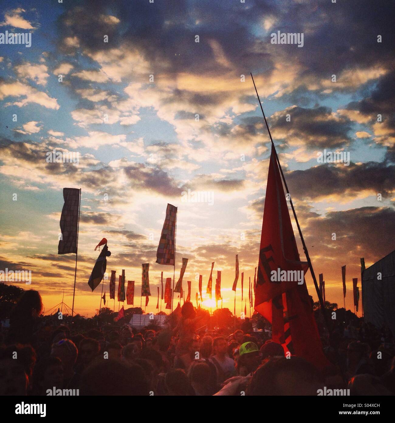 Sunset, crowd and atmosphere at Glastonbury festival 2014 Stock Photo