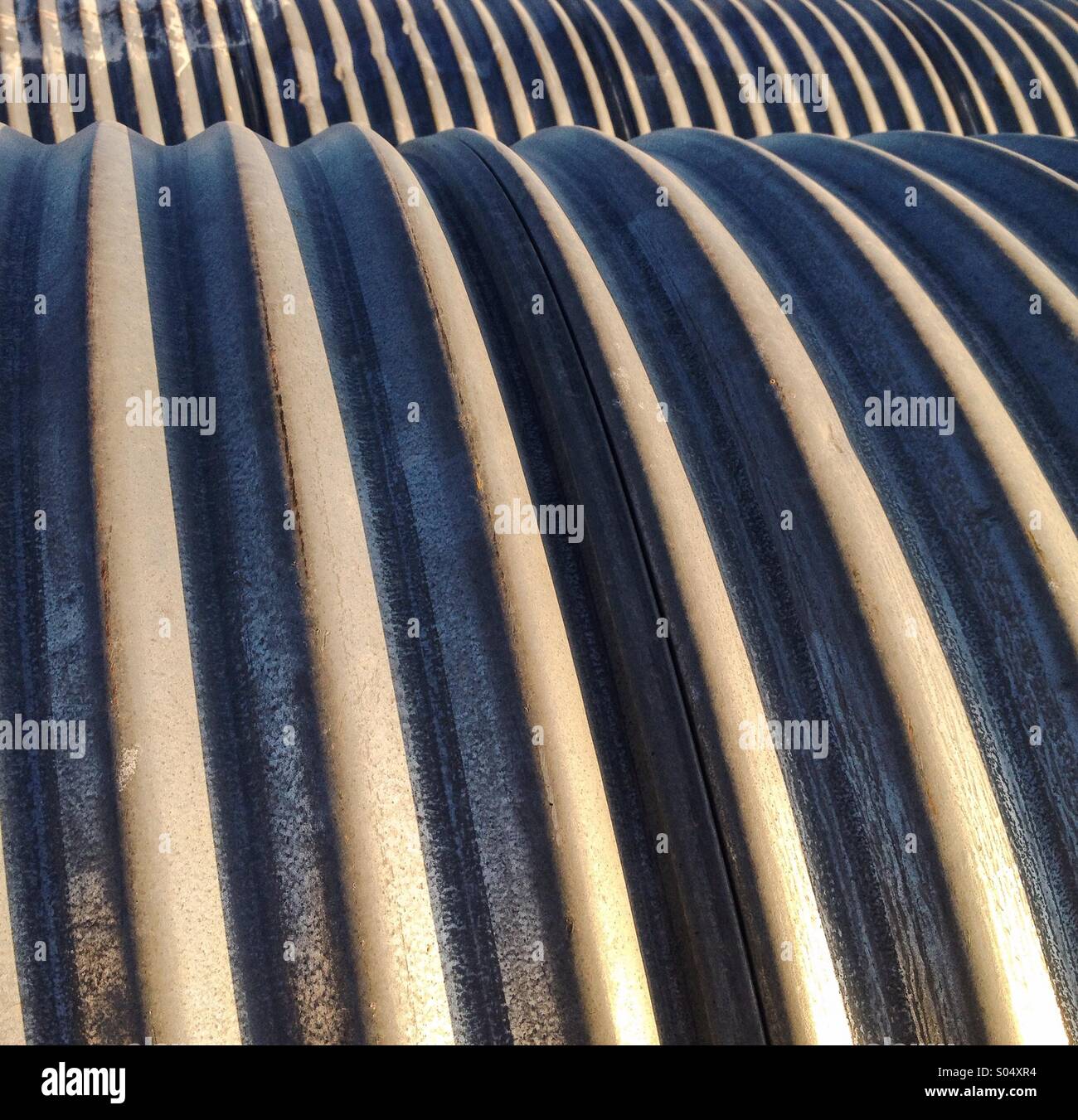 Metal pipes in a row. - Smartphone Captured Stock Image