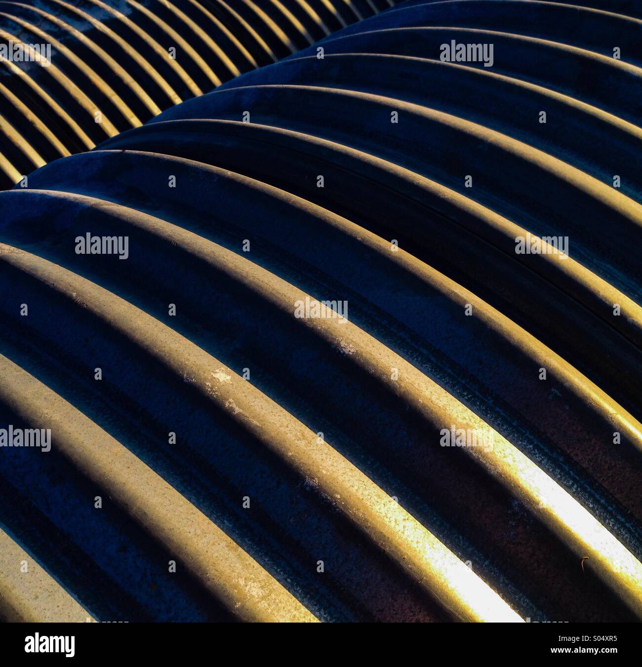 Metal pipes in a row. - Smartphone Captured Stock Image