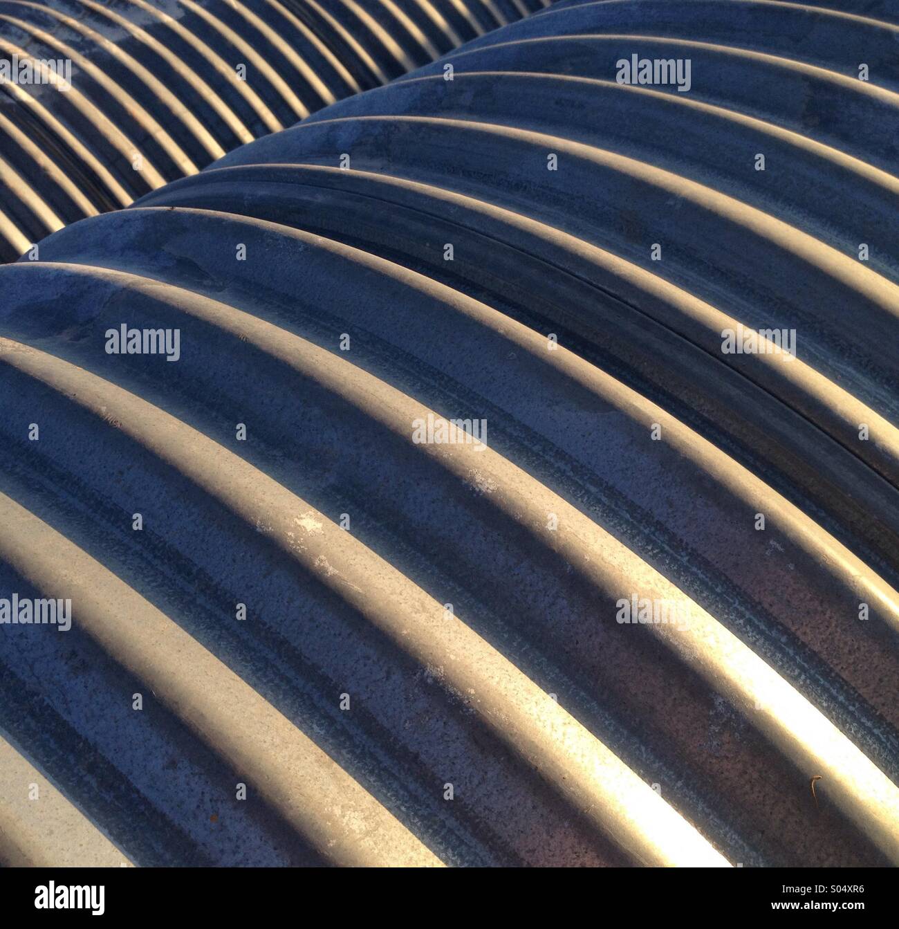 Metal pipes in a row. - Smartphone Captured Stock Image