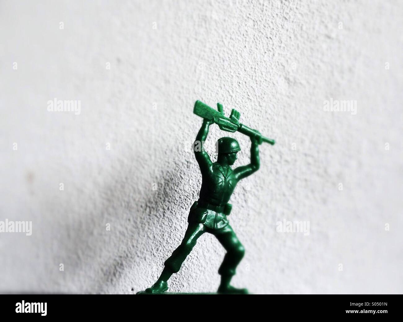 Plastic green toy soldier Stock Photo