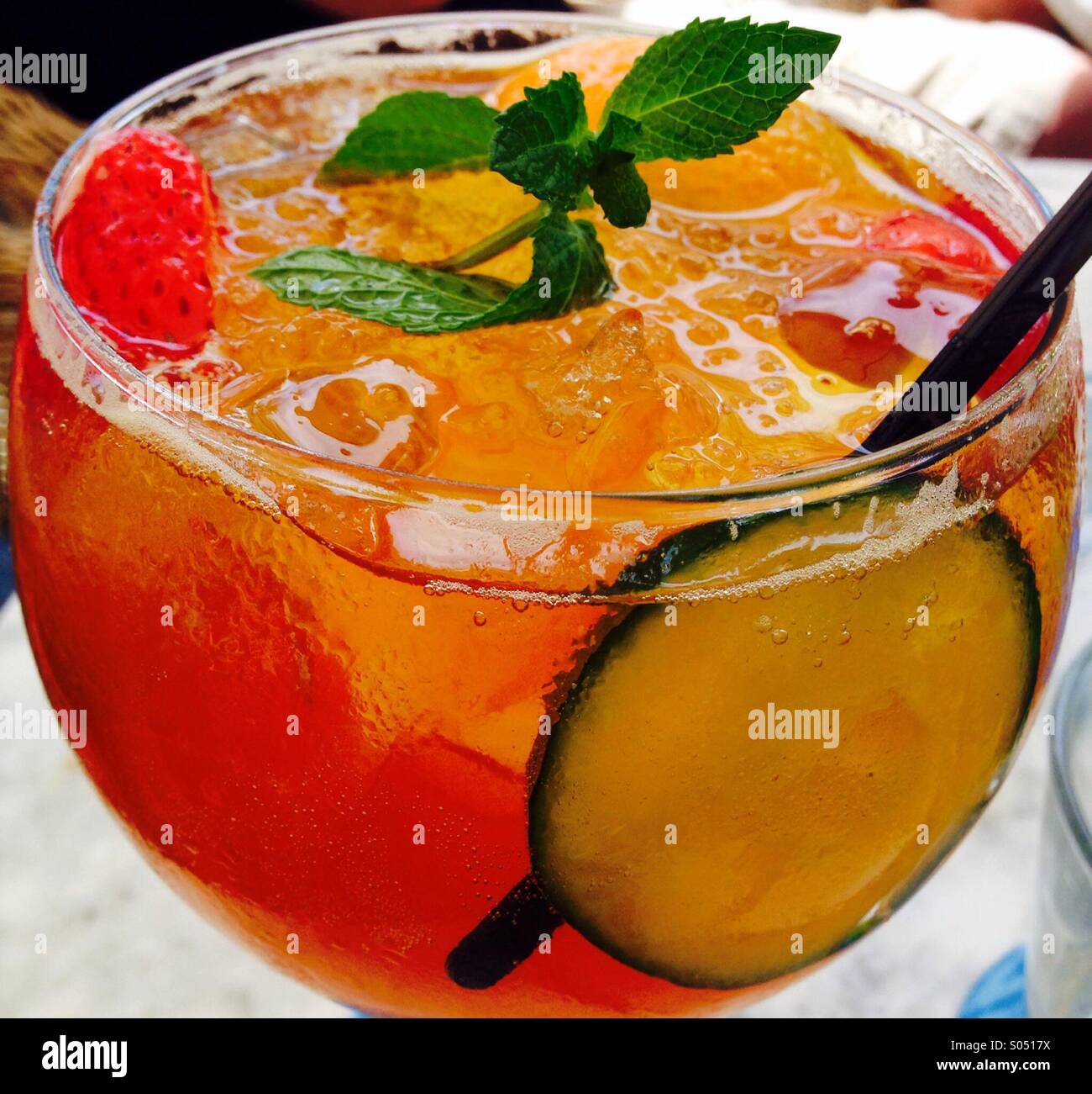 Balloon glass full of fruit and Pimms - Smartphone Captured Stock Image