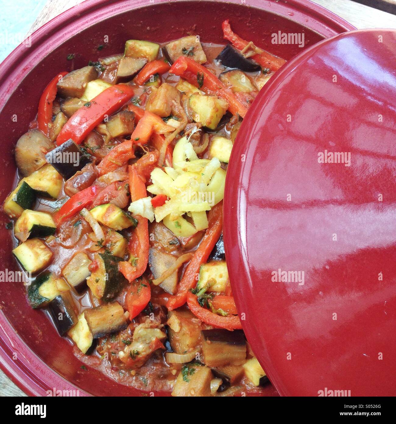 Vegetarian tagine with Aubergine courgette and red pepper, topped with sliced preserved lemon