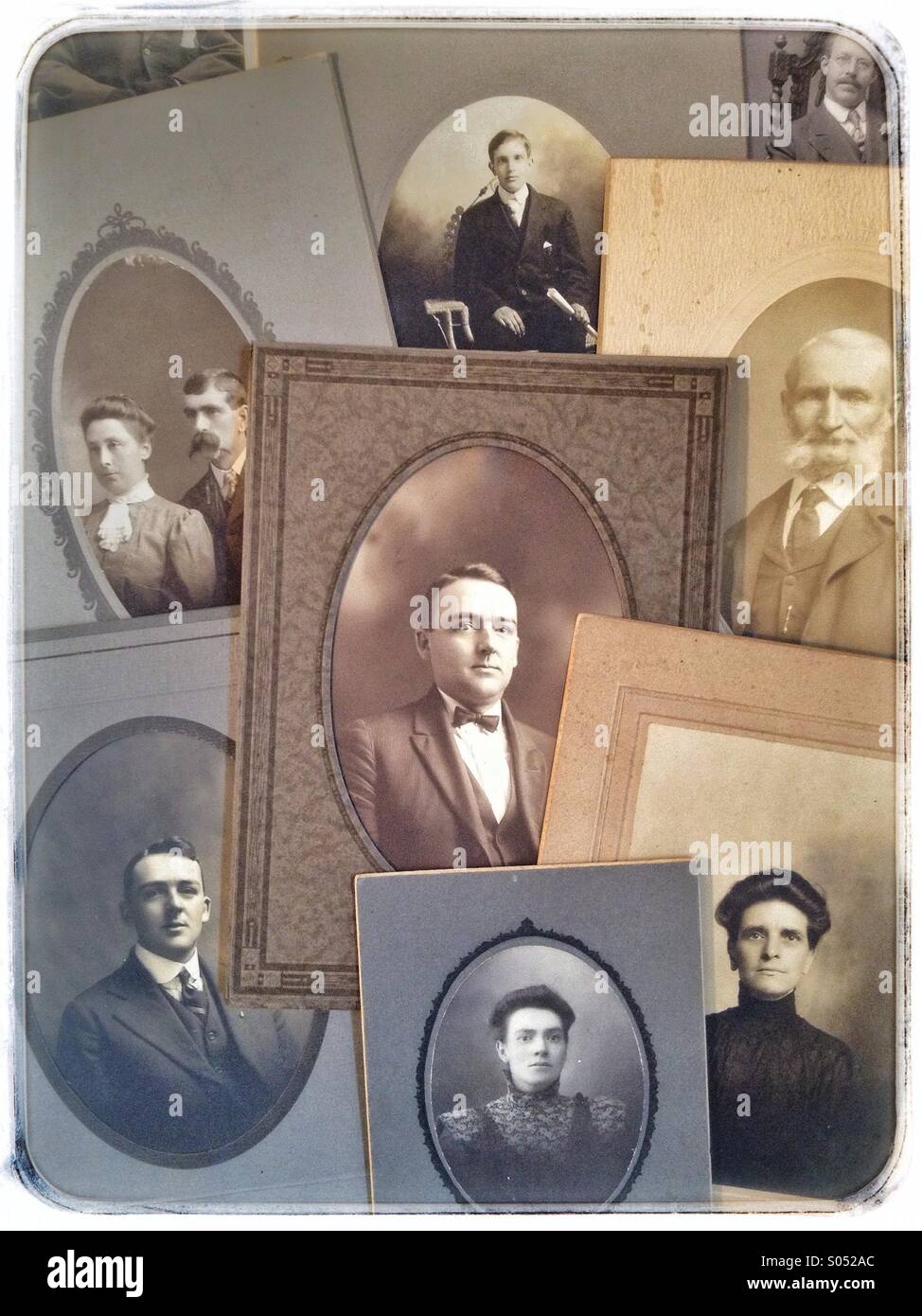 Group of vintage portrait photographs on table Stock Photo