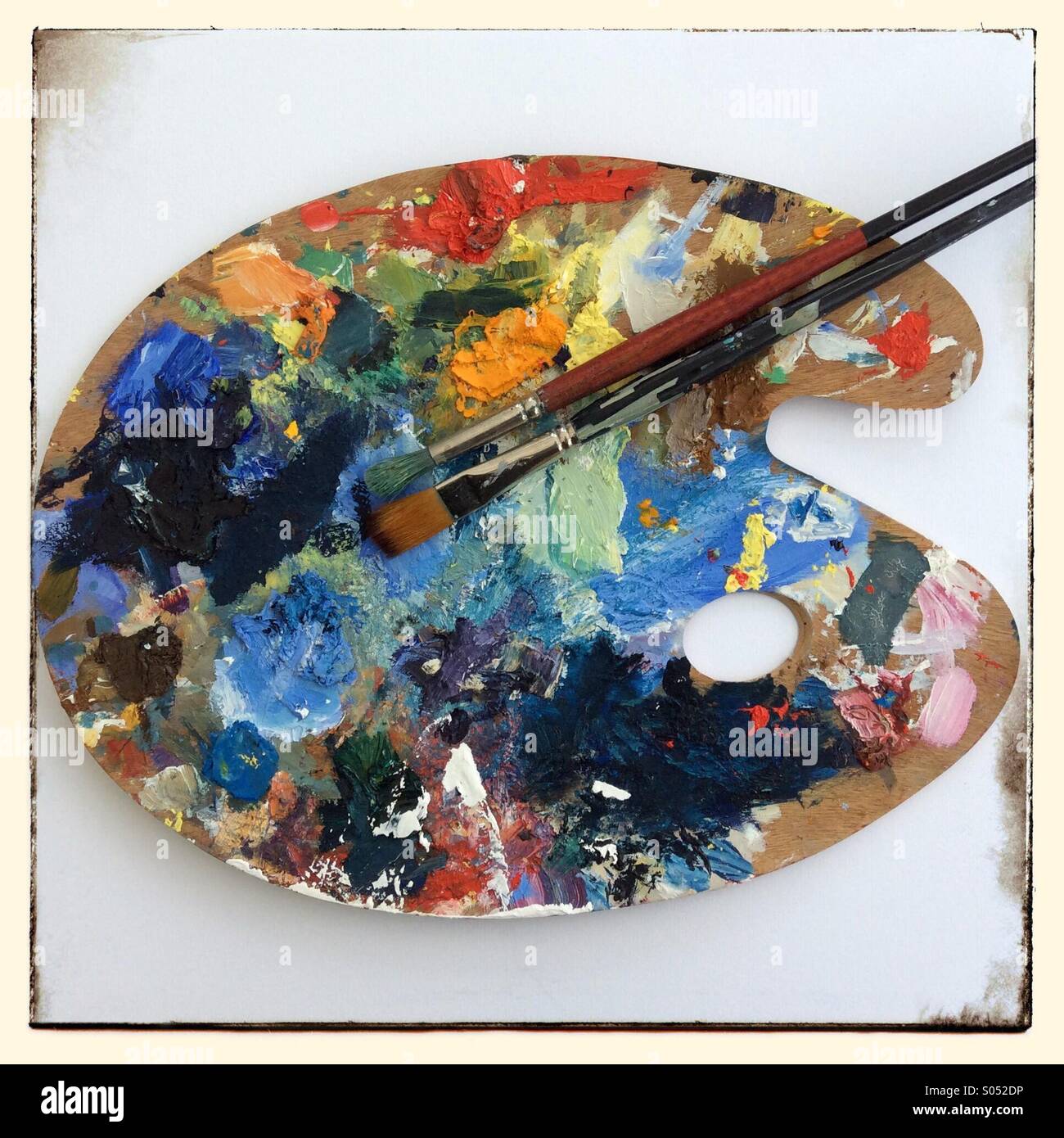 Traditional style art palette with two brushes - Smartphone Captured Stock Image