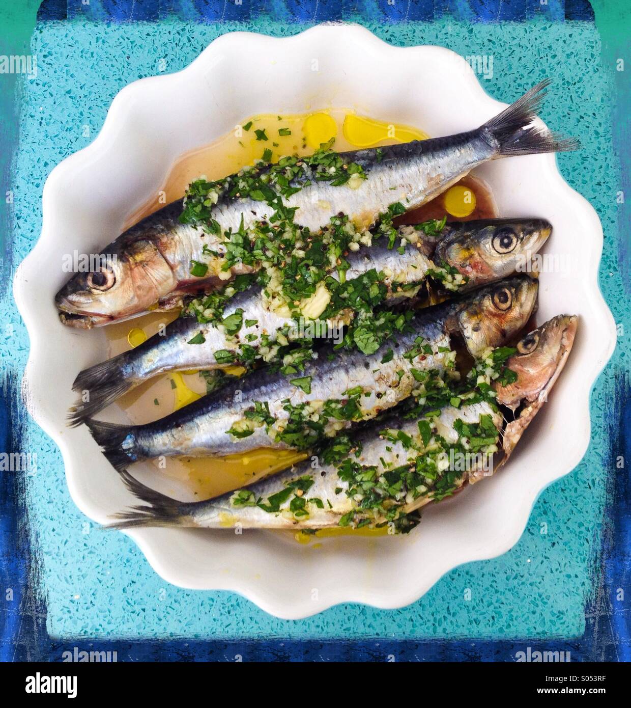 Sardines in lemon juice, garlic,olive oil and coriander Stock Photo Alamy