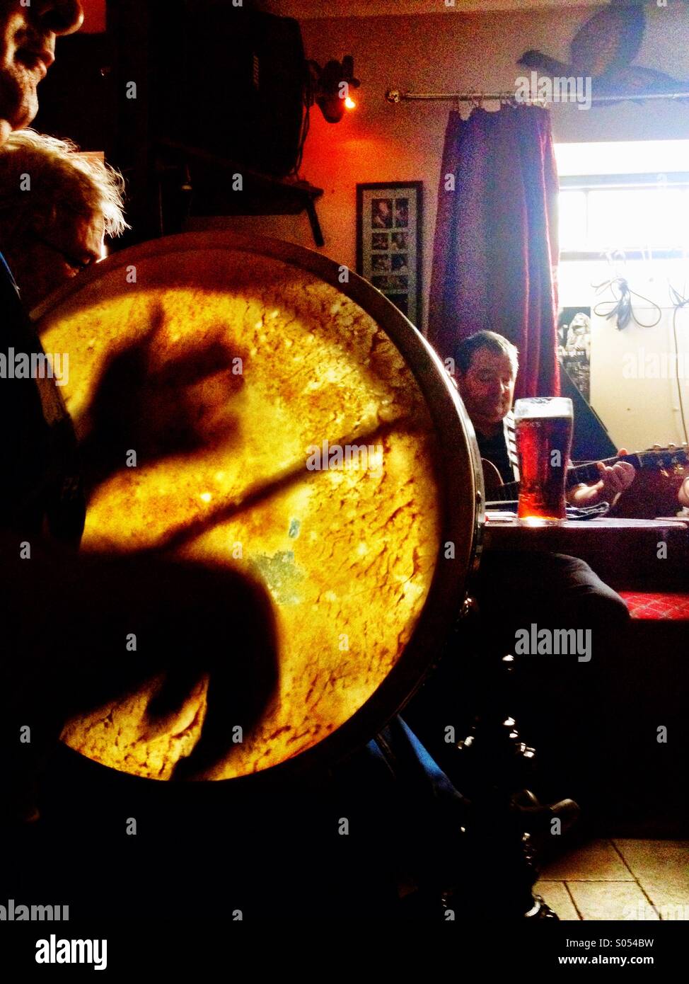 Playing the Bodhran Stock Photo Alamy