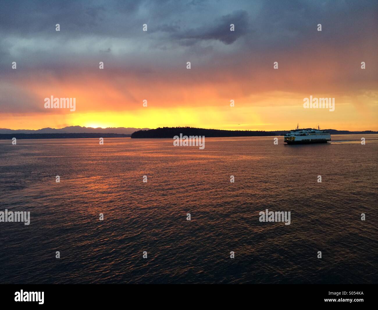 Vashon Island ferry at sunset, Olympic Mountains behind, Puget sound