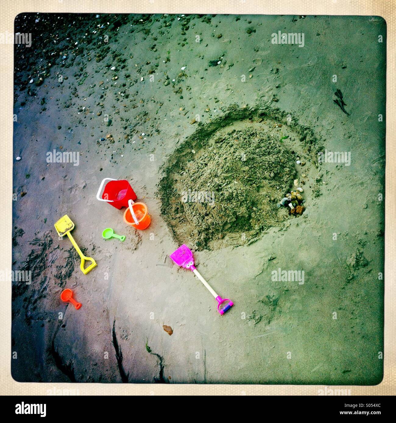 Sand castle and buckets and spades Stock Photo Alamy