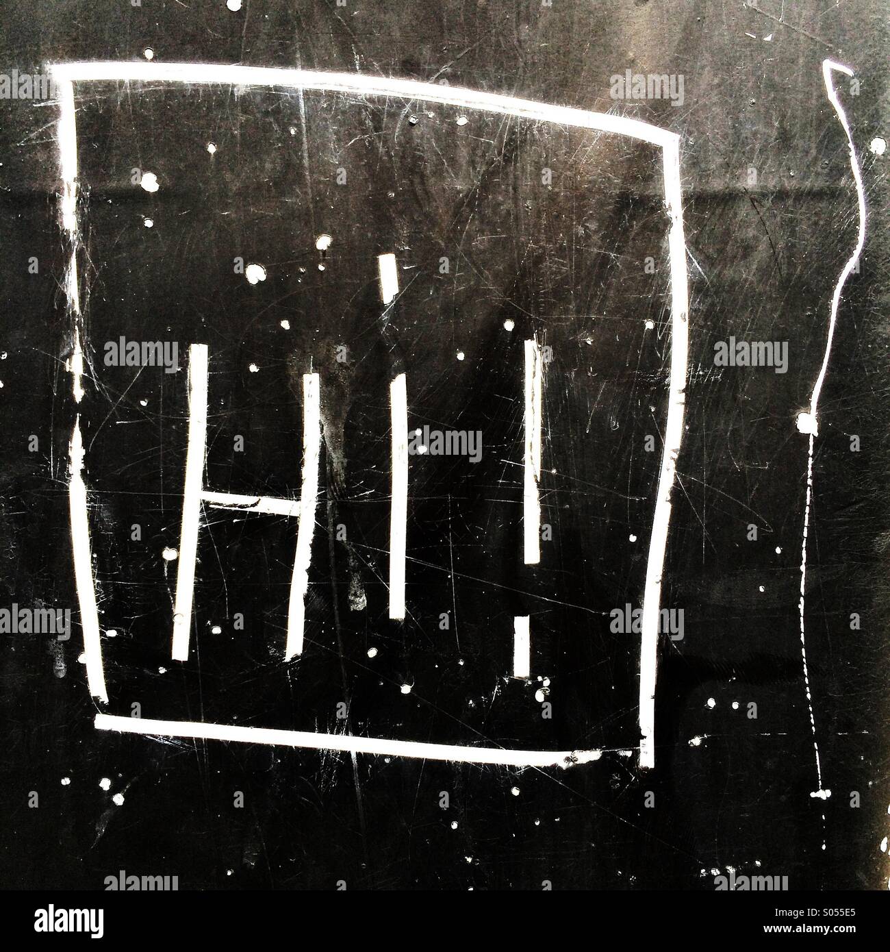 Hi! Graffiti etched onto wall Stock Photo