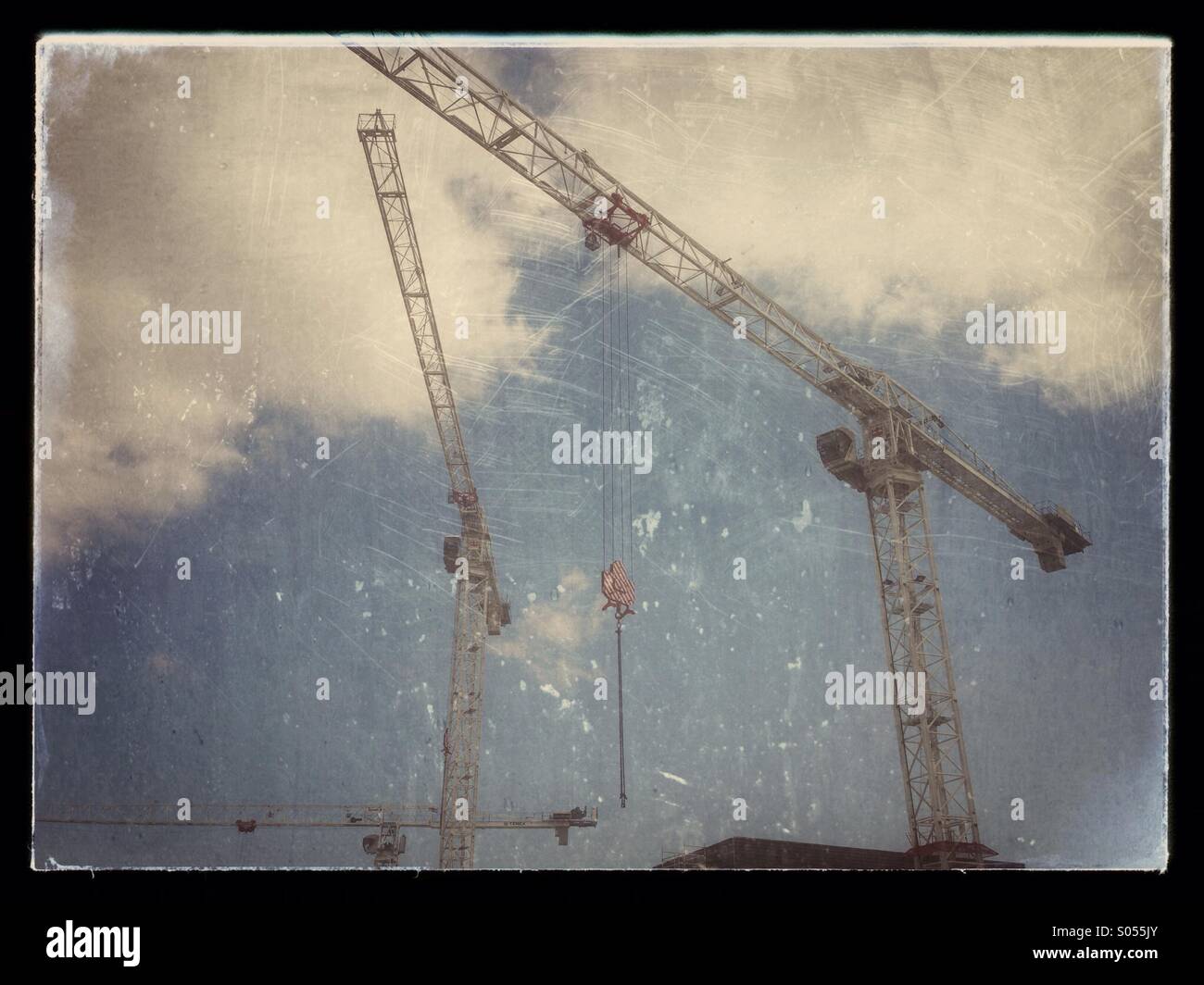 Three cranes on a Construction site - Smartphone Captured Stock Image