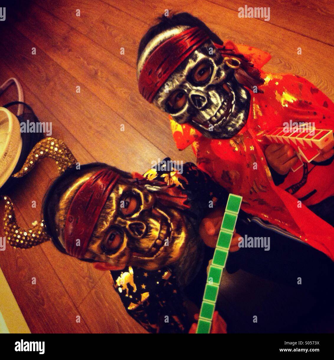2 friends are ready for halloween. They dress like skeleton monsters - Smartphone Captured Stock Image