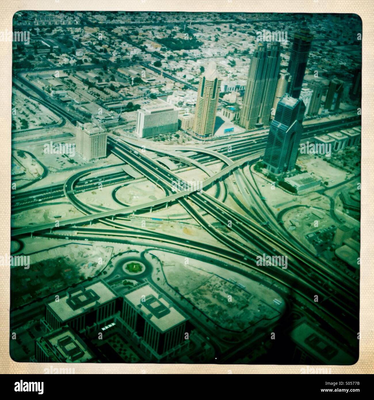 A view of the freeway below from one of the top floors of the Burj Khalifa (the tallest building in the world). Dubai, United Arab Emirates. - Smartphone Captured Stock Image