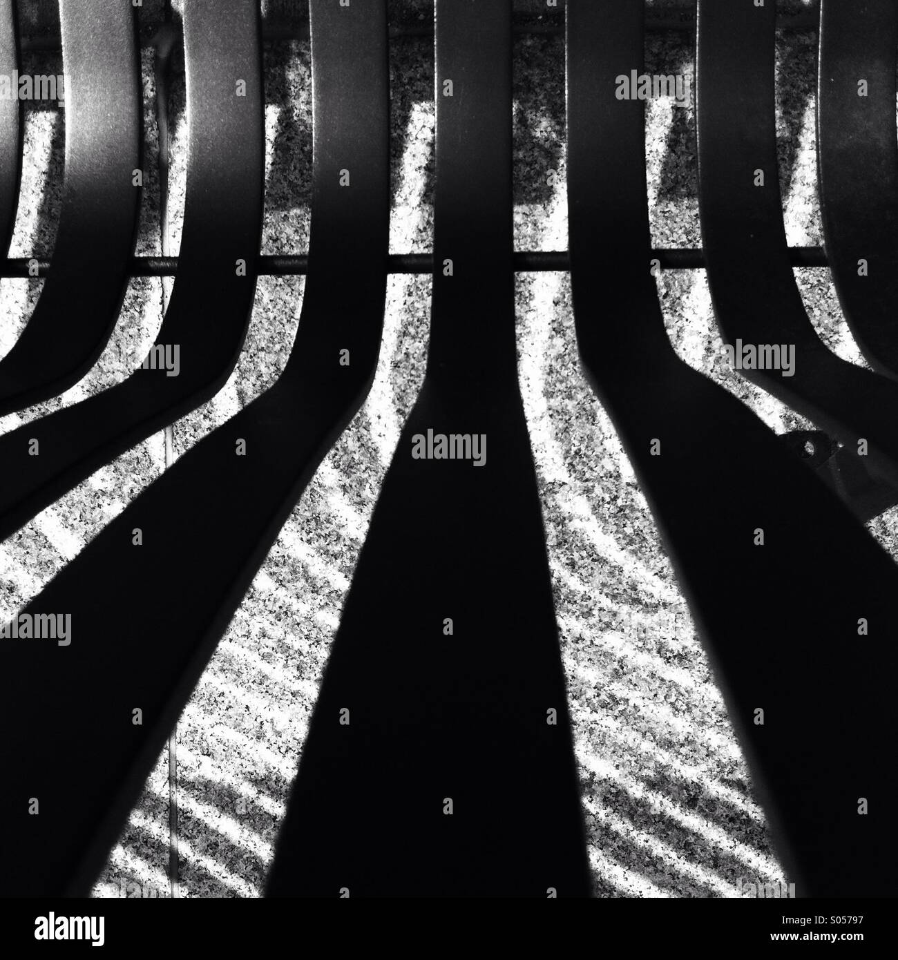 Monochrome image of the metal elements of the street bench 2014. - Smartphone Captured Stock Image