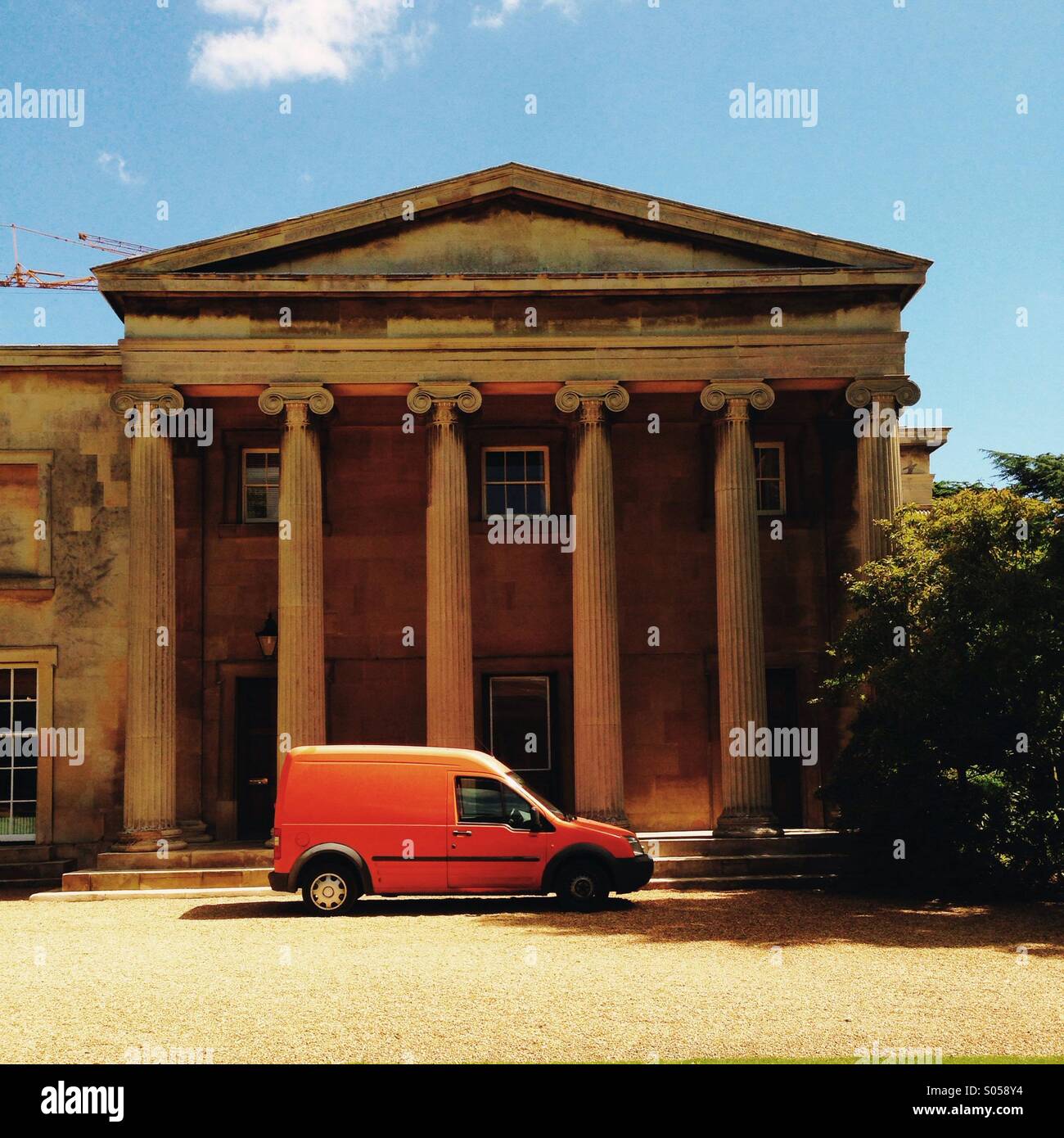 Orange van by roman columns - Smartphone Captured Stock Image