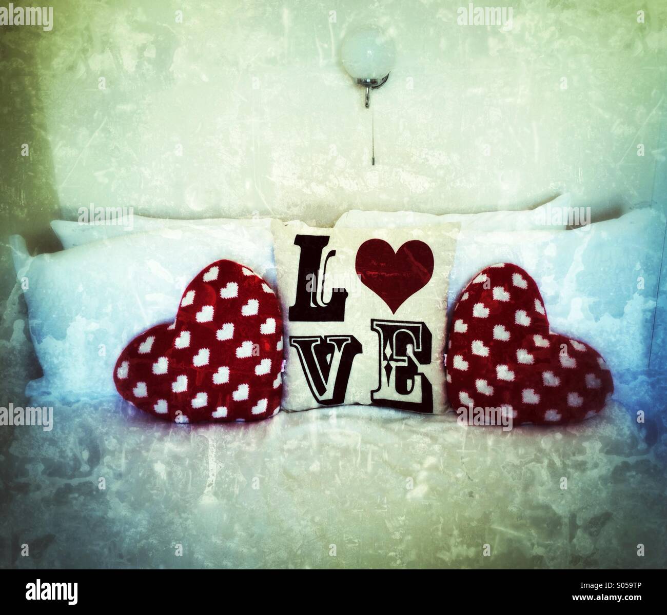 Love pillows on a bed Stock Photo Alamy