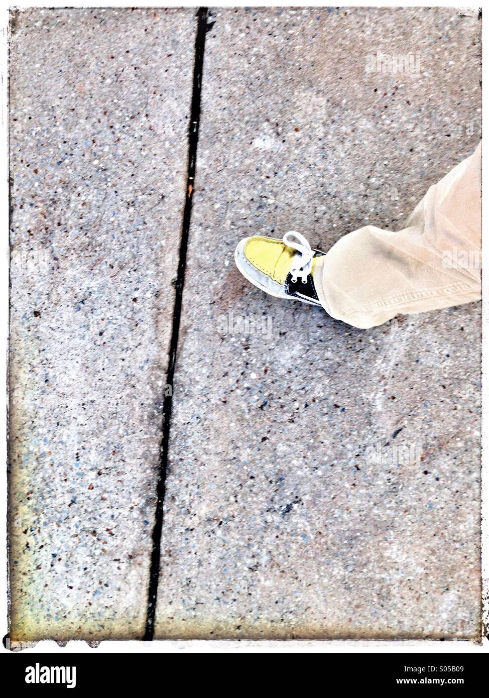 Leg and shoe on the footpath. - Smartphone Captured Stock Image