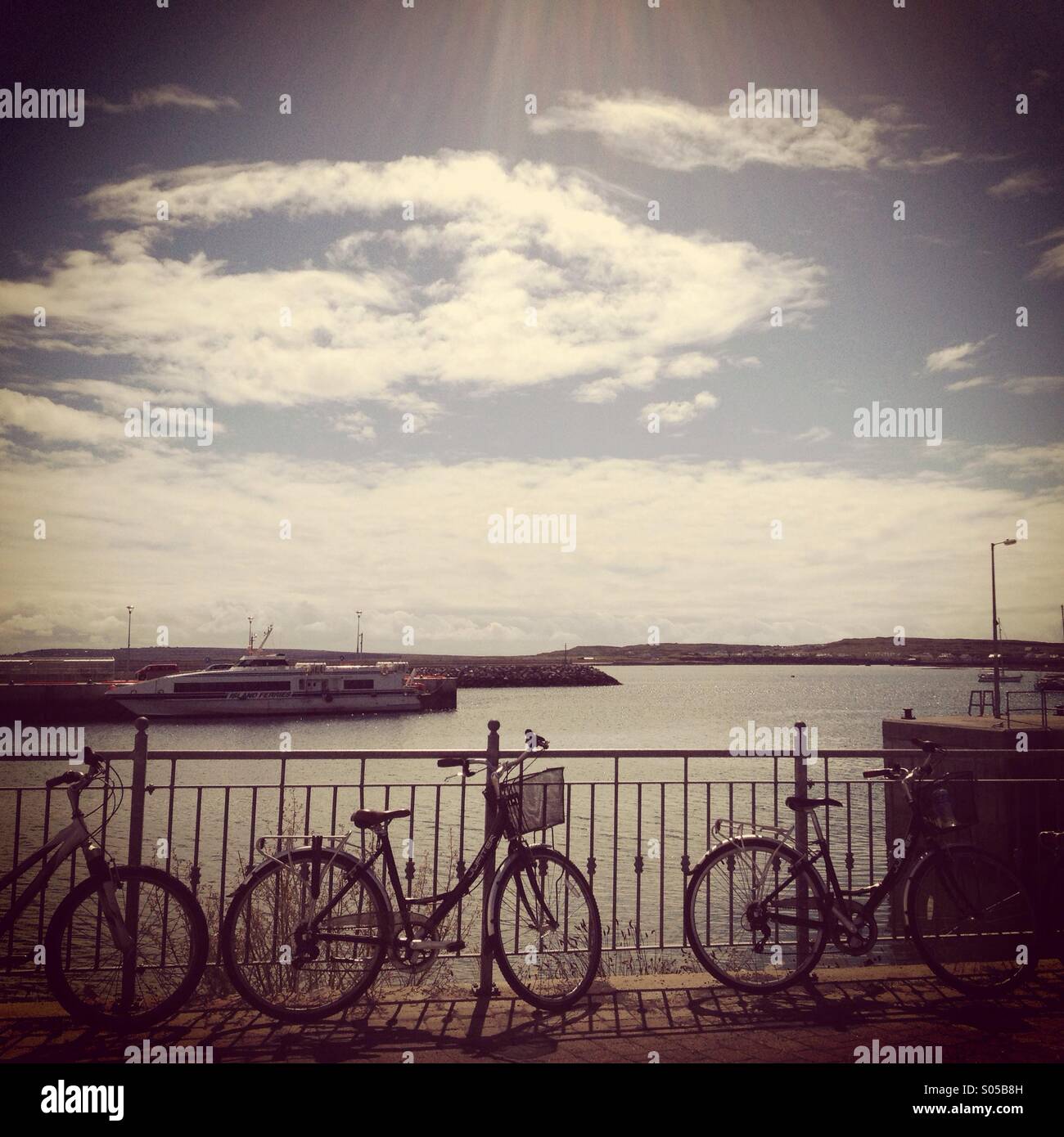 Bicycles parked beside the pier on Inis Mor, the Aran Islands, Ireland. - Smartphone Captured Stock Image