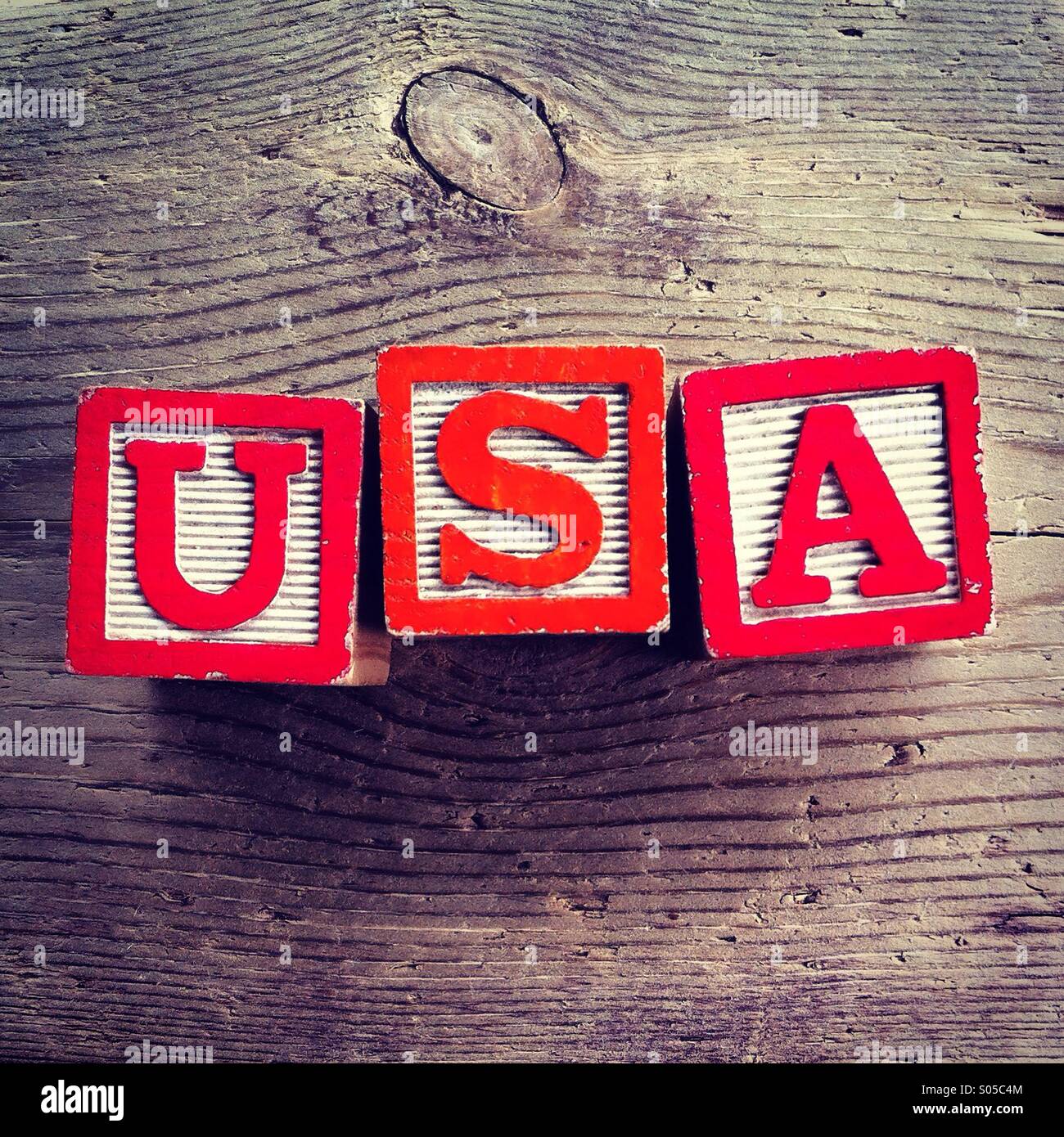It's a photo of wood blocks toy with letters that form the acronym word USA - Smartphone Captured Stock Image