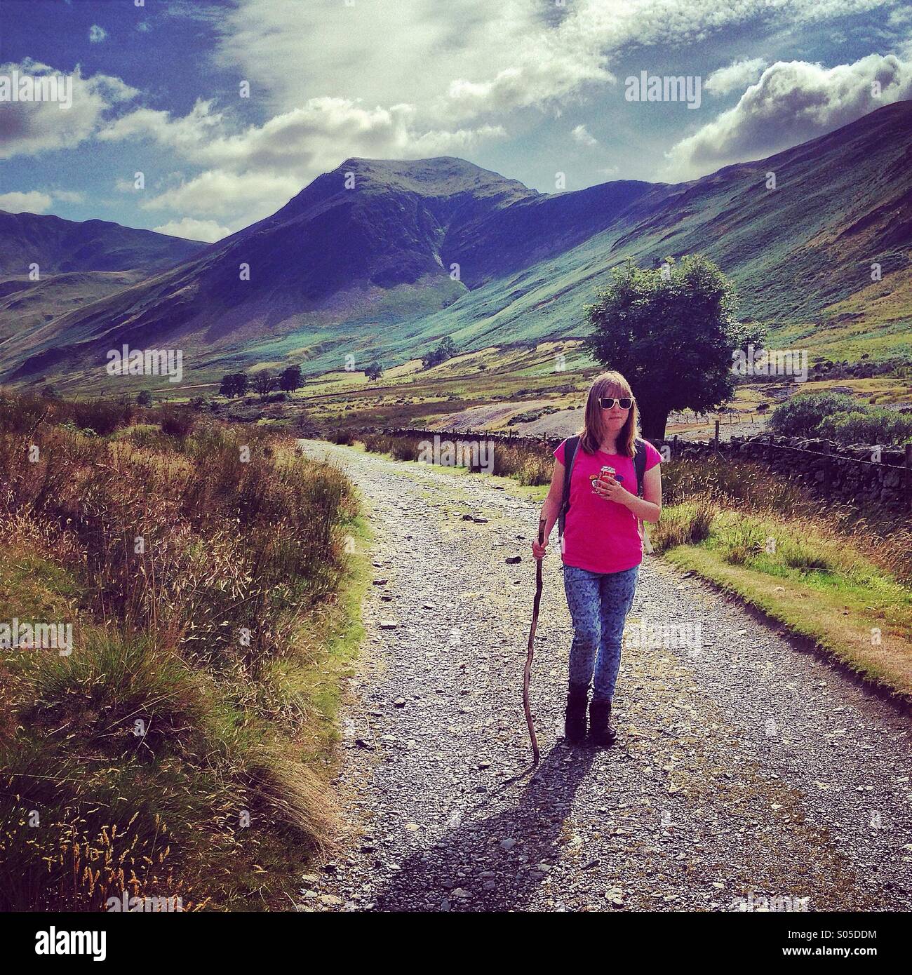 A teenager walking in the Newlands valley in the Lake District - Smartphone Captured Stock Image