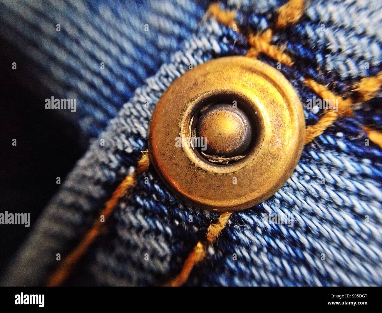 Stud on a pair of jeans Stock Photo Alamy