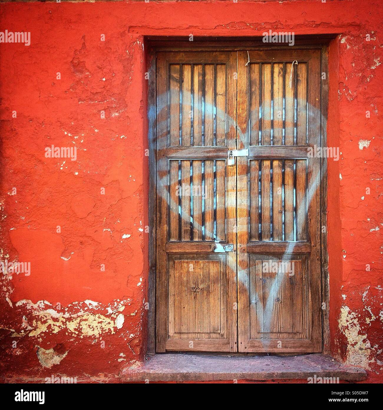 A blue heart covers a door in Guanajuato, Mexico - Smartphone Captured Stock Image